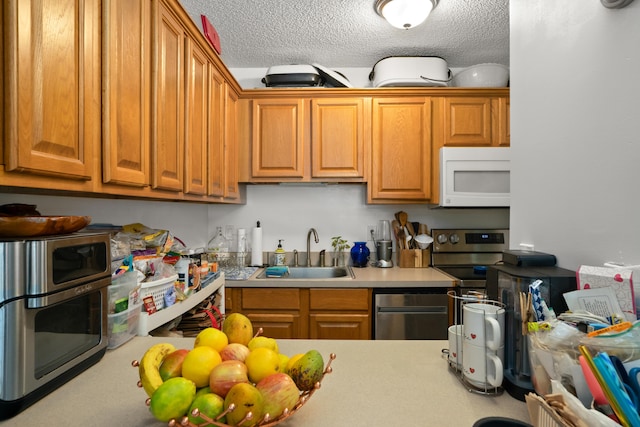 3-3400 Kuhio Hwy Unit B101, Lihue, HI 96766 - kitchen with white microwave, light countertops, a textured ceiling, and brown cabinetry