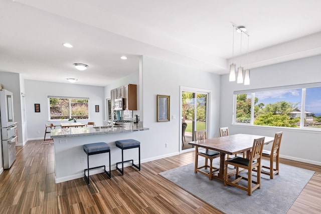68-2182 Laakea Way, Waikoloa, HI 96738 - dining area featuring healthy amount of natural light, dark wood-style flooring, and recessed lighting