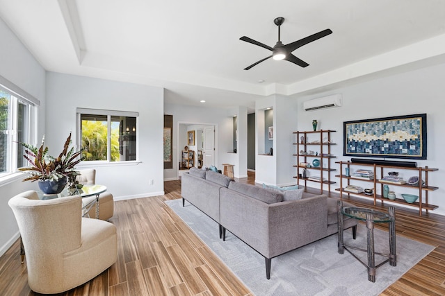 68-2182 Laakea Way, Waikoloa, HI 96738 - living room featuring a wall unit AC, a tray ceiling, wood finished floors, a ceiling fan, and recessed lighting