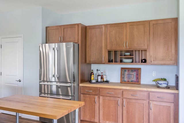 68-2182 Laakea Way, Waikoloa, HI 96738 - kitchen with high quality fridge, light countertops, and brown cabinetry