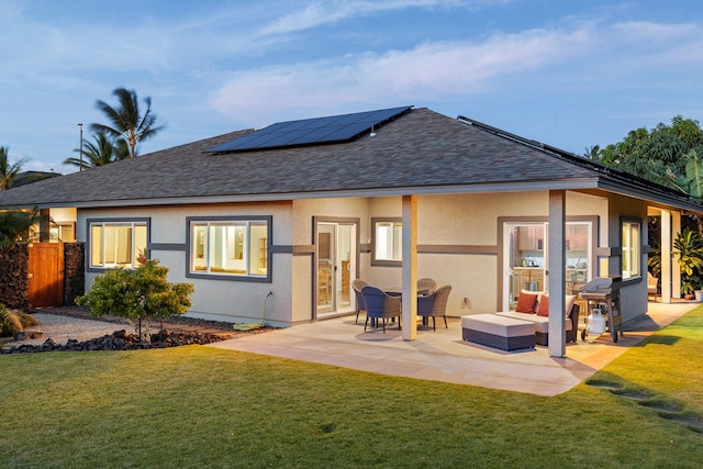 68-2182 Laakea Way, Waikoloa, HI 96738 - back of property with roof with shingles, solar panels, a patio, and stucco siding