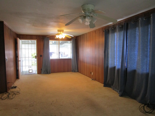 478 Hilinai St, Hilo, HI 96720 - spare room with wooden walls, carpet floors, and ceiling fan