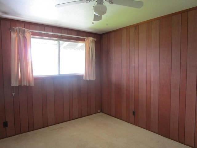 478 Hilinai St, Hilo, HI 96720 - carpeted spare room with a ceiling fan and wood walls