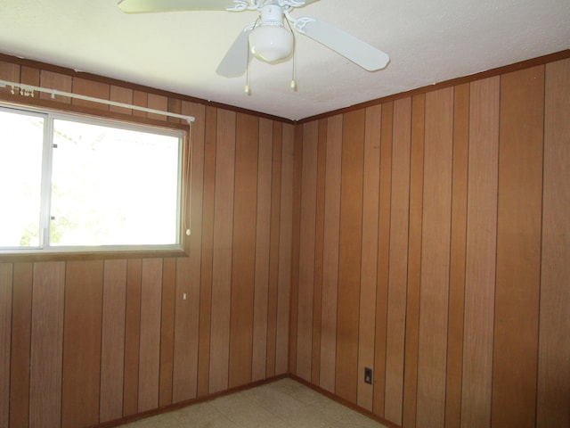 478 Hilinai St, Hilo, HI 96720 - spare room with wooden walls, ceiling fan, and light flooring