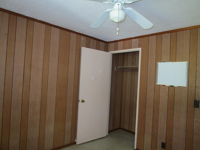 478 Hilinai St, Hilo, HI 96720 - unfurnished bedroom with ceiling fan and wood walls