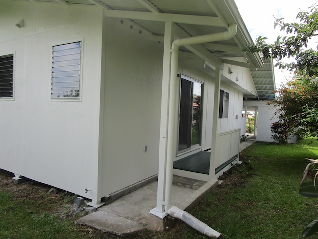 478 Hilinai St, Hilo, HI 96720 - view of side of property with a lawn