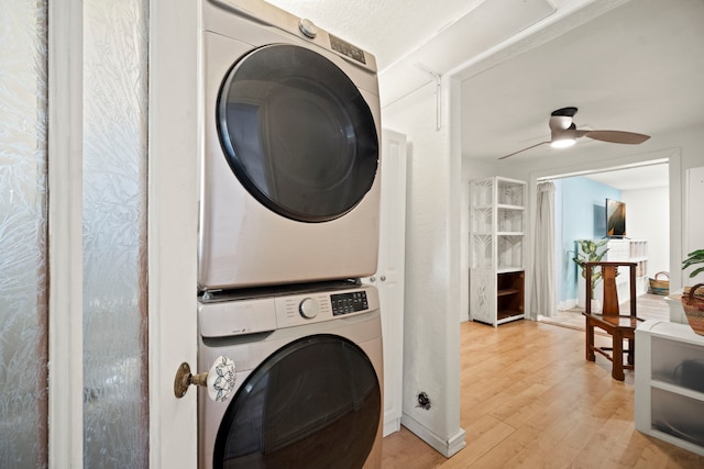 2375 Kipuka St, Koloa, HI 96756 - washroom with stacked washer / drying machine, light wood-style flooring, and ceiling fan