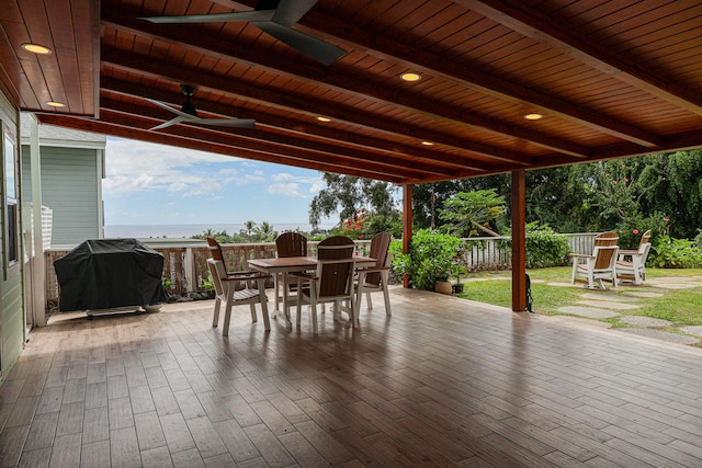 76-206 Kealoha St Unit 2A, Kailua-Kona, HI 96740 - fenced backyard with outdoor dining area, ceiling fan, and area for grilling