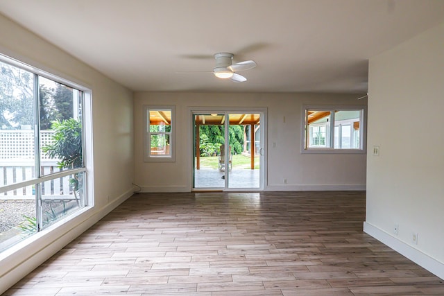 76-206 Kealoha St Unit 2A, Kailua-Kona, HI 96740 - empty room with a ceiling fan and light wood finished floors