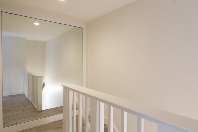 76-206 Kealoha St Unit 2A, Kailua-Kona, HI 96740 - hall featuring an upstairs landing, recessed lighting, and light wood-style floors