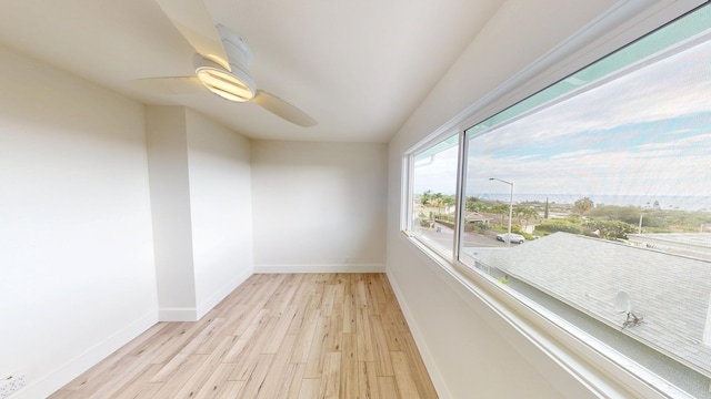 76-206 Kealoha St Unit 2A, Kailua-Kona, HI 96740 - empty room featuring a ceiling fan and light wood-style floors