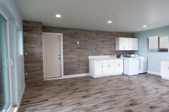 76-206 Kealoha St Unit 2A, Kailua-Kona, HI 96740 - washroom with cabinet space, washer and dryer, electric panel, recessed lighting, and wood finished floors