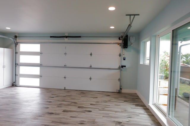 76-206 Kealoha St Unit 2A, Kailua-Kona, HI 96740 - garage featuring recessed lighting and baseboards