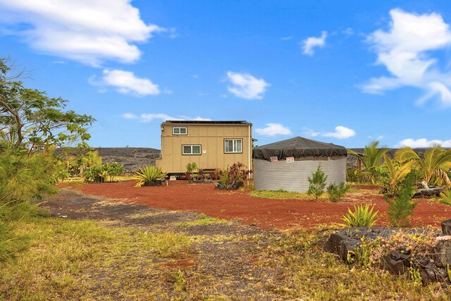 1 Piilani Rd, Pahoa, HI 96778 - rear view of property with a shed