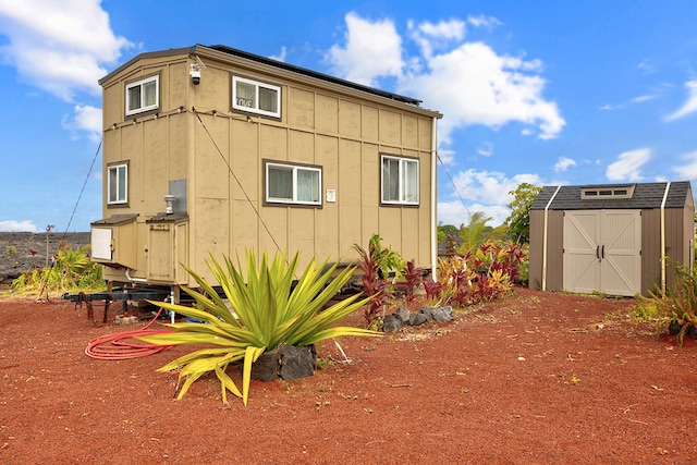 1 Piilani Rd, Pahoa, HI 96778 - view of home's exterior featuring a storage shed
