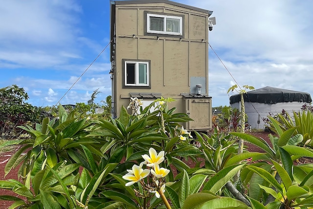 1 Piilani Rd, Pahoa, HI 96778 - view of side of home featuring stucco siding