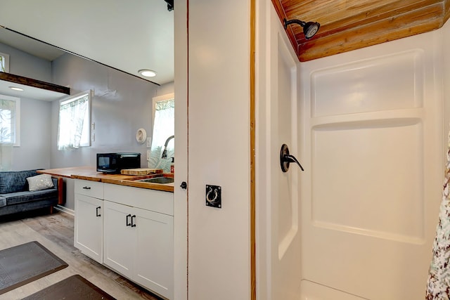 1 Piilani Rd, Pahoa, HI 96778 - bathroom with vanity, wood finished floors, and a shower