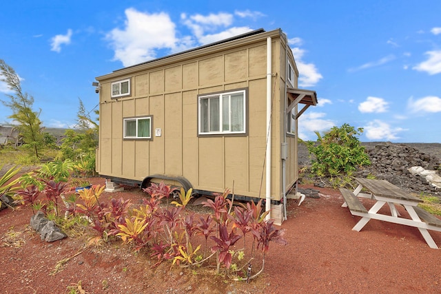 1 Piilani Rd, Pahoa, HI 96778 - view of side of property with board and batten siding