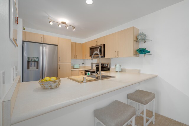 68-3932 Ehu Kai Loop Unit 3403, Waikoloa, HI 96738 - kitchen featuring stainless steel appliances, light brown cabinetry, and a peninsula