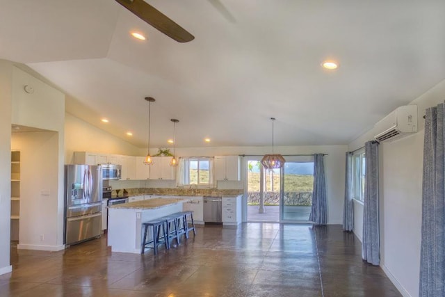 73-4369 Mau Loa Hema Pl, Kailua-Kona, HI 96740 - kitchen with stainless steel appliances, a wall mounted AC, lofted ceiling, a center island, and white cabinetry