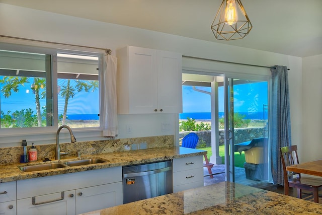 73-4369 Mau Loa Hema Pl, Kailua-Kona, HI 96740 - kitchen with dishwasher, white cabinets, light stone counters, and hanging light fixtures