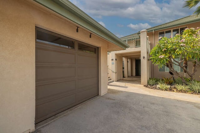 62-3600 Amaui Pl Unit J101, Kamuela, HI 96743 - garage featuring asphalt driveway