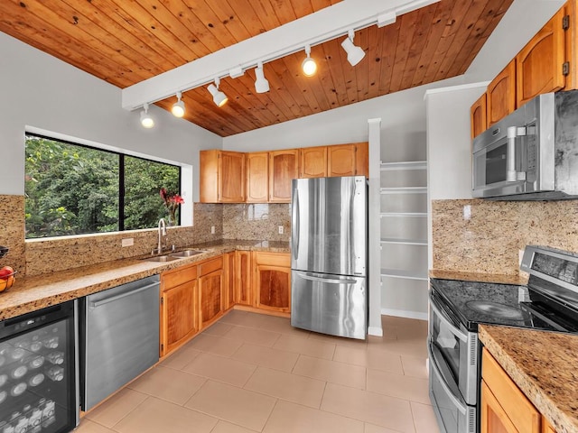 87-3216 Carissa Rd, Captain Cook, HI 96704 - kitchen featuring stainless steel appliances, rail lighting, wine cooler, backsplash, and light countertops