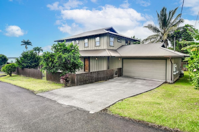 39 Kula Pl Unit 1, Hilo, HI 96720 - view of front facade with driveway, board and batten siding, a garage, and a metal roof