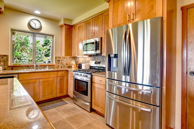 39 Kula Pl Unit 1, Hilo, HI 96720 - kitchen with stainless steel appliances, light stone counters, decorative backsplash, light tile patterned floors, and recessed lighting