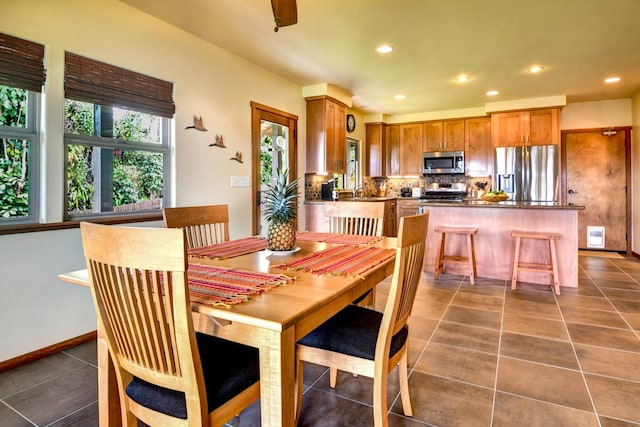 39 Kula Pl Unit 1, Hilo, HI 96720 - dining space with dark tile patterned floors and recessed lighting
