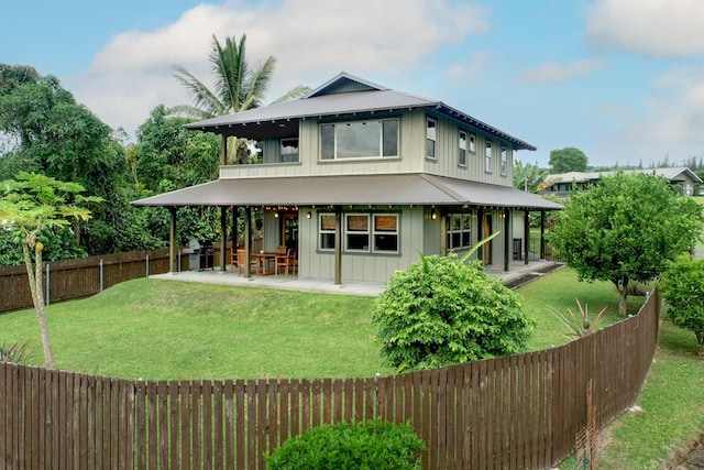 39 Kula Pl Unit 1, Hilo, HI 96720 - rear view of property featuring a fenced backyard, a patio area, and board and batten siding