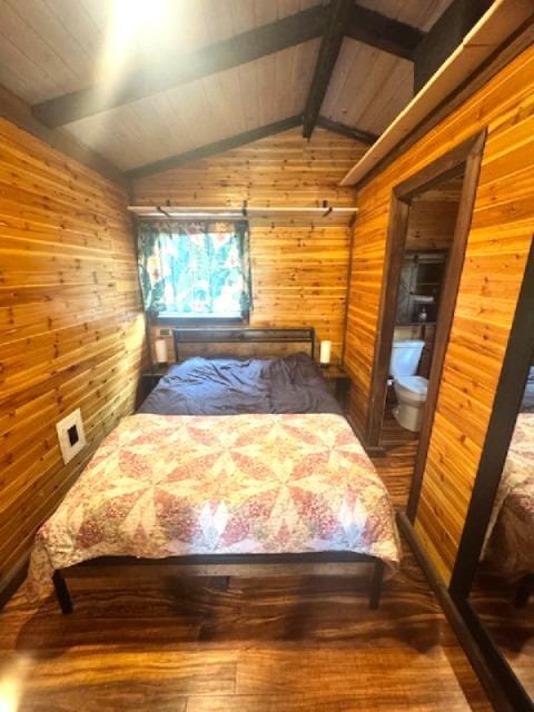 18-2026 Mahena St, Volcano, HI 96785 - bedroom featuring wooden walls, wood finished floors, and wood ceiling