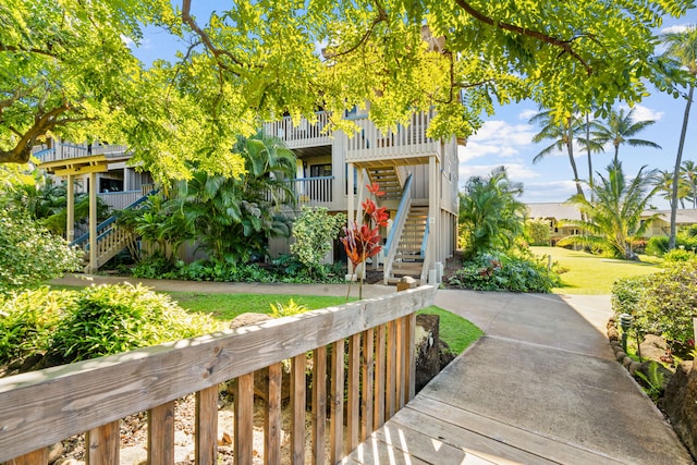 1870 Hoone Rd Unit 511, Koloa, HI 96756 - beach home with stairway, a front lawn, and a balcony