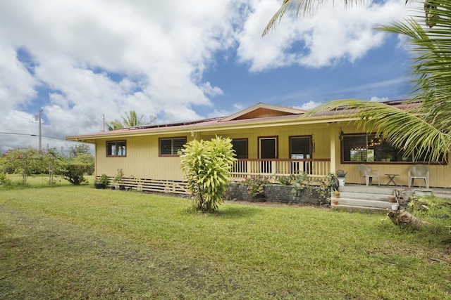 16-295 Orchidland Dr, Kurtistown, HI 96760 - rear view of property featuring a yard and a porch