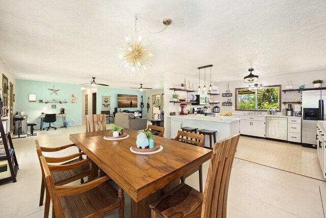 16-295 Orchidland Dr, Kurtistown, HI 96760 - dining space with a textured ceiling, a chandelier, and a ceiling fan