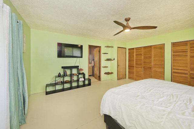 16-295 Orchidland Dr, Kurtistown, HI 96760 - bedroom with two closets, a textured ceiling, connected bathroom, and ceiling fan