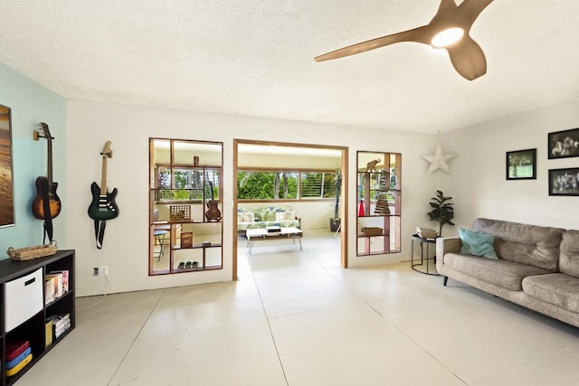 16-295 Orchidland Dr, Kurtistown, HI 96760 - living room featuring ceiling fan and a textured ceiling