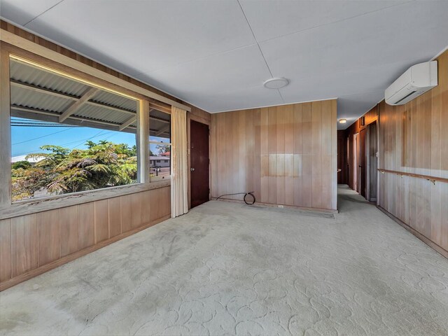 196 Iwalani St, Hilo, HI 96720 - empty room featuring an AC wall unit and wood walls