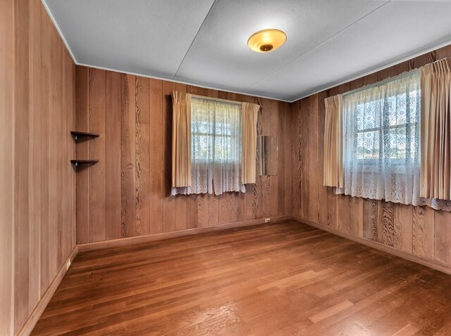 196 Iwalani St, Hilo, HI 96720 - unfurnished room featuring wood finished floors and wood walls