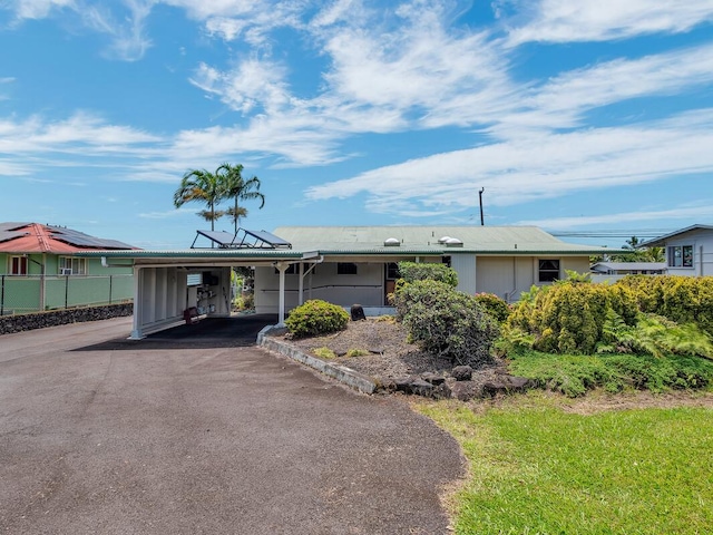 196 Iwalani St, Hilo, HI 96720 - ranch-style home featuring a carport and driveway