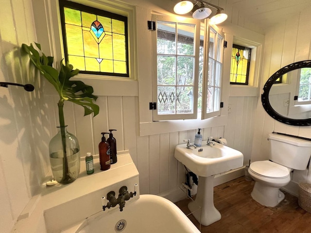 15-1884 9th Ave, Keaau, HI 96749 - bathroom featuring wood finished floors, a decorative wall, and wainscoting