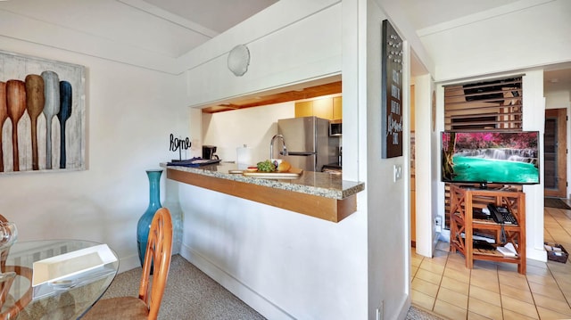 2253 Poipu Rd Unit 218, Koloa, HI 96756 - kitchen featuring stainless steel appliances and tile patterned floors