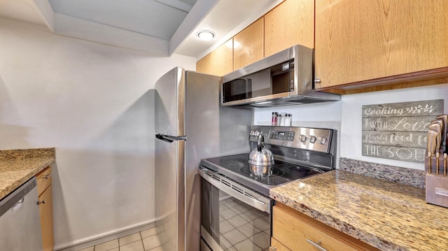 2253 Poipu Rd Unit 218, Koloa, HI 96756 - kitchen featuring stainless steel appliances, light tile patterned flooring, and light stone countertops