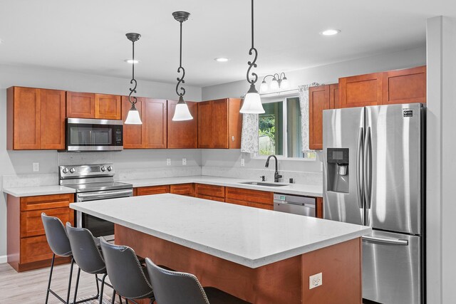 15-1730 29th Ave, Keaau, HI 96749 - kitchen featuring appliances with stainless steel finishes, a breakfast bar, pendant lighting, brown cabinets, and recessed lighting