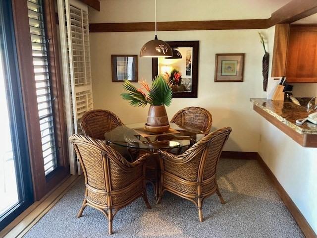 2253 Poipu Rd Unit 418, Koloa, HI 96756 - dining space with carpet and baseboards