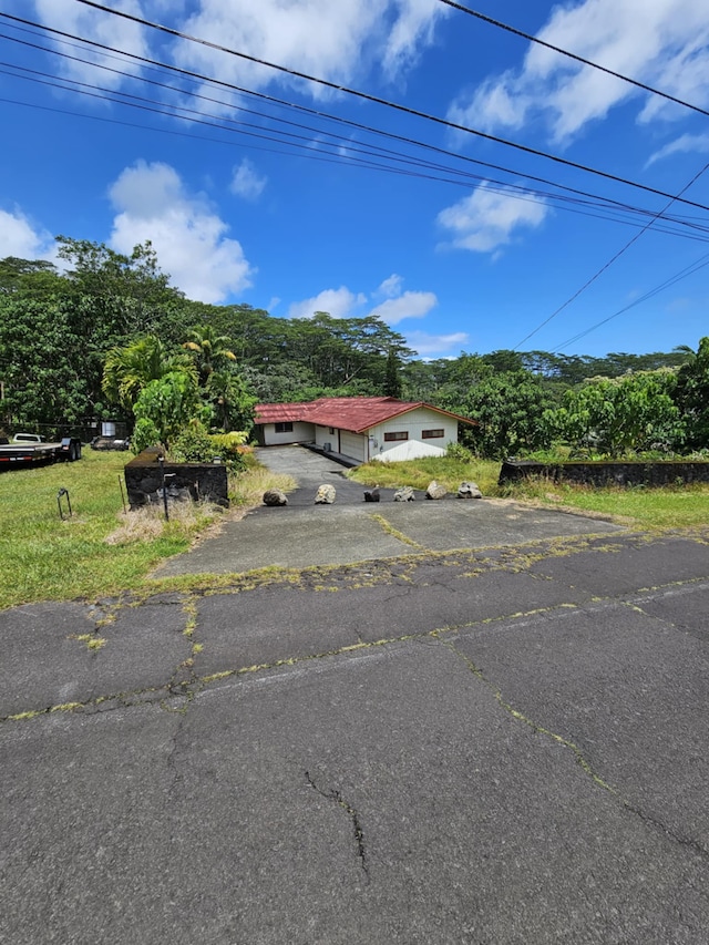 17-233 Ipuaiwaha St, Keaau, HI 96749 - view of front of house with driveway