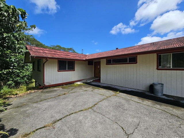 17-233 Ipuaiwaha St, Keaau, HI 96749 - back of property with a metal roof and a patio