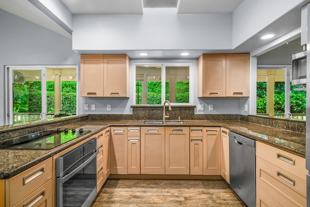 2895 Wawae Rd, Kalaheo, HI 96741 - kitchen with black appliances, light brown cabinets, a peninsula, dark stone counters, and recessed lighting
