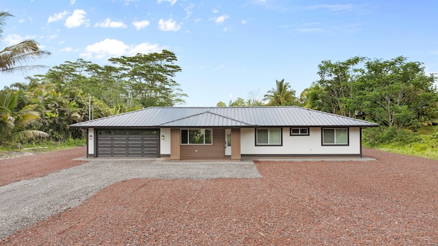 15-1408 13th Ave, Keaau, HI 96749 - single story home with driveway, an attached garage, and a metal roof