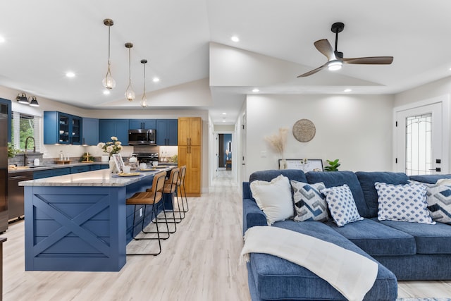 15-1408 13th Ave, Keaau, HI 96749 - living room with recessed lighting, ceiling fan, vaulted ceiling, and light wood-style flooring